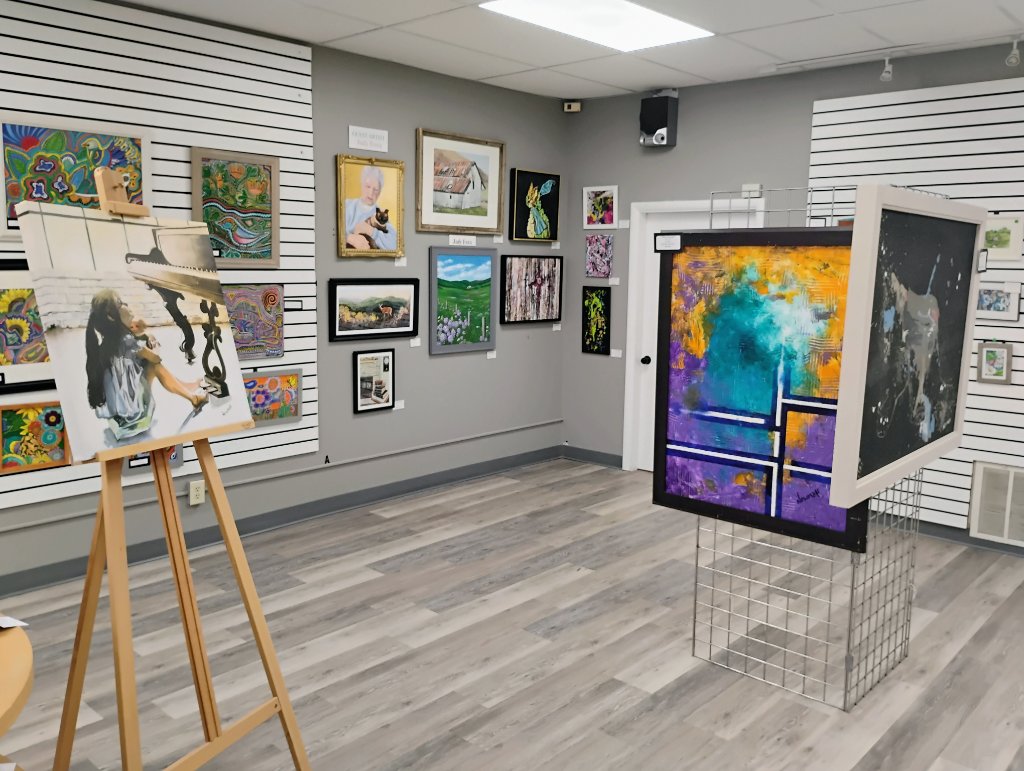 Gallery interior showing paintings and artwork on display