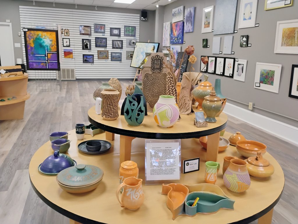 Round table display of handcrafted pottery and ceramics