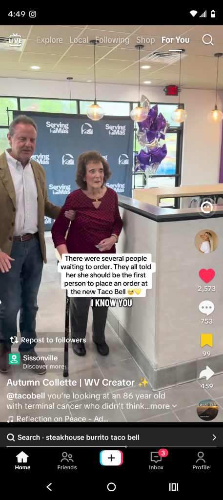 Pauline being escorted in as the very first customer at the new Sissonville Taco Bell