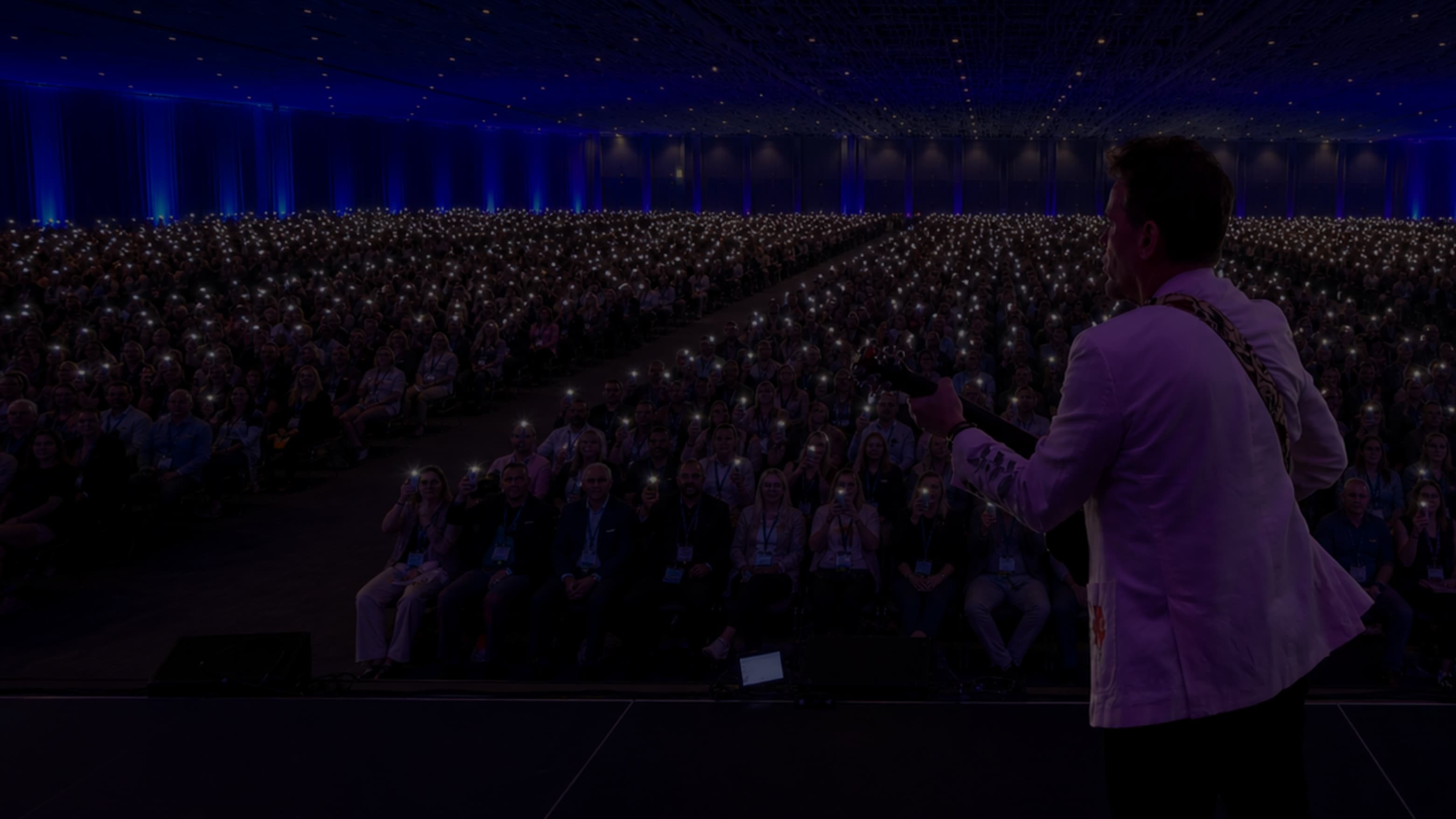 Brant speaking on stage