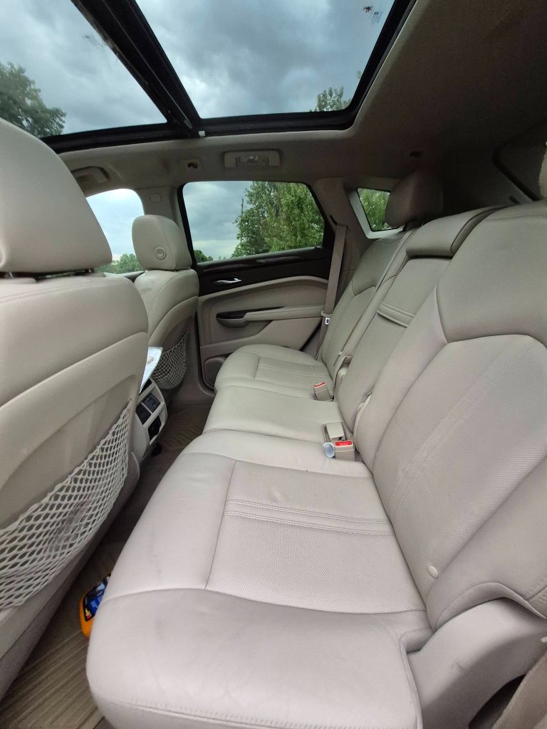 The 2014 Cadillac SRX Luxury Collection AWD in Crystal Red Tintcoat.