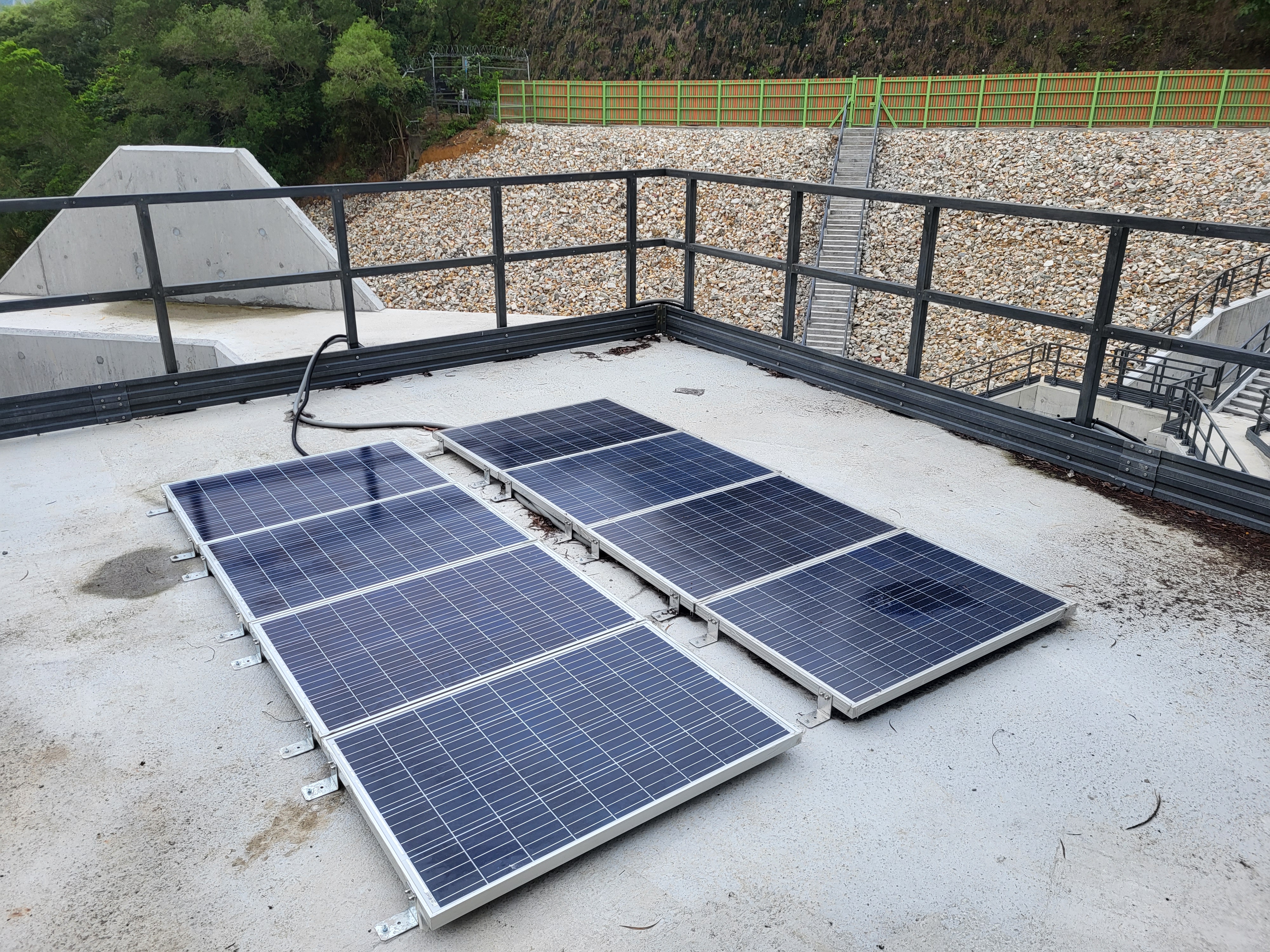 Solar panels powering off-grid ImageDeep edge units on a reservoir platform
