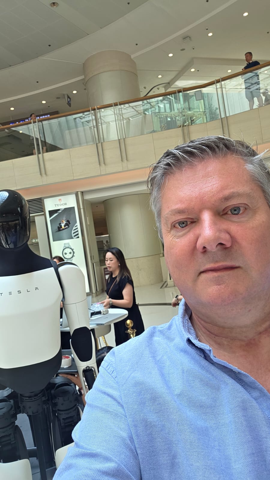 Niall Dorr, founder of ImageDeep, with a Tesla Optimus humanoid robot