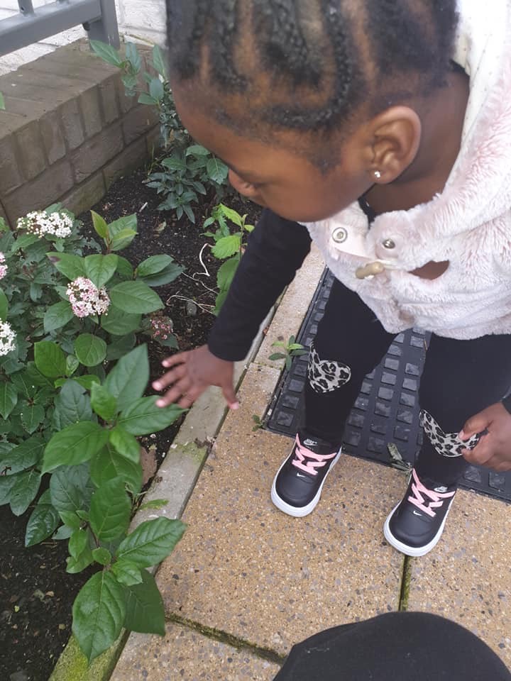 A child exploring the garden during Covid