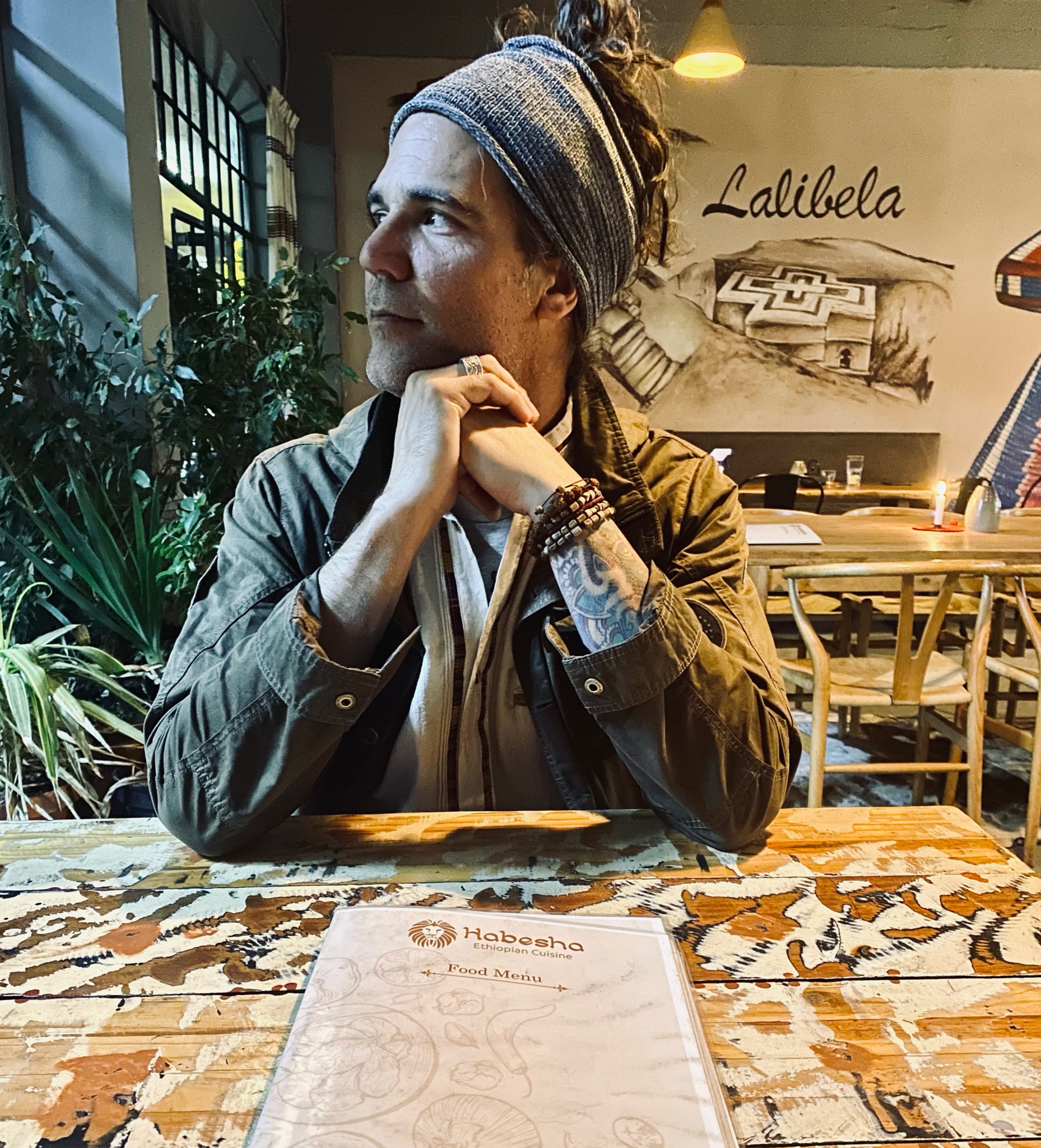 Joel Serino seated at a table at Habesha Ethiopian Cuisine