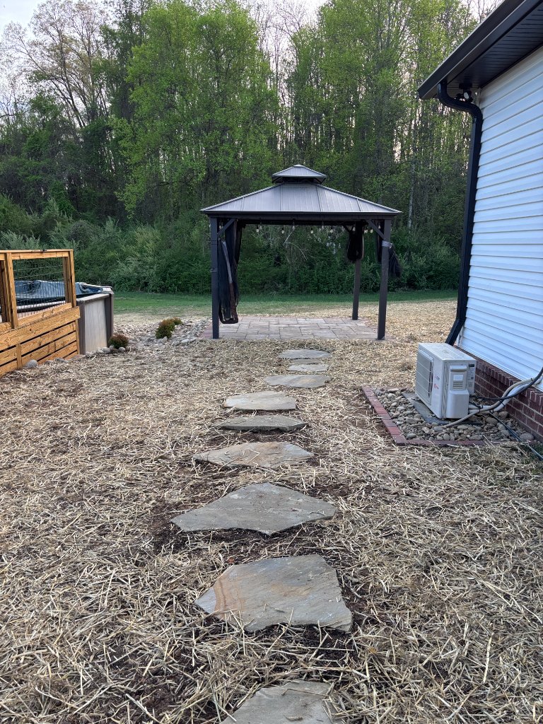 Flagstone stepping stone walkway leading to patio and gazebo in Knoxville TN by Grateful Grounds