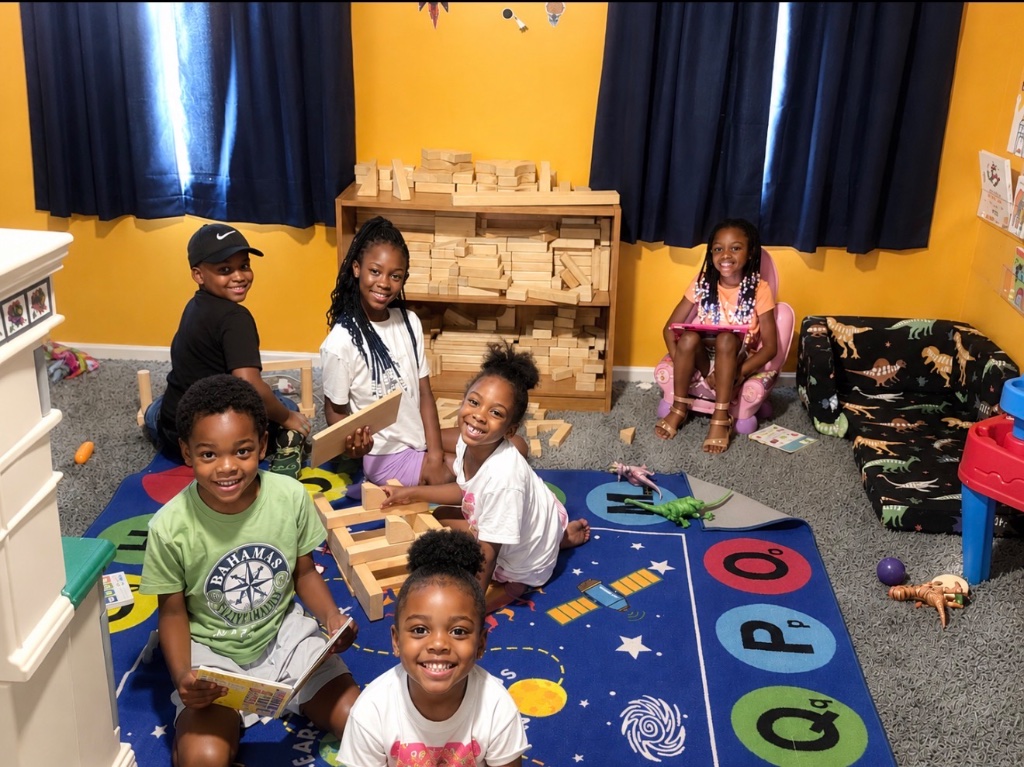Collaborative STEM Block Building Children building with wooden blocks during a collaborative STEM learning activity at Insight Kidz Care in Baltimore.