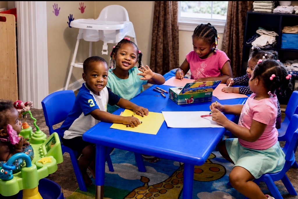 Coloring & Drawing Time Children coloring and drawing with crayons at a table activity at Insight Kidz Care licensed family child care Baltimore MD