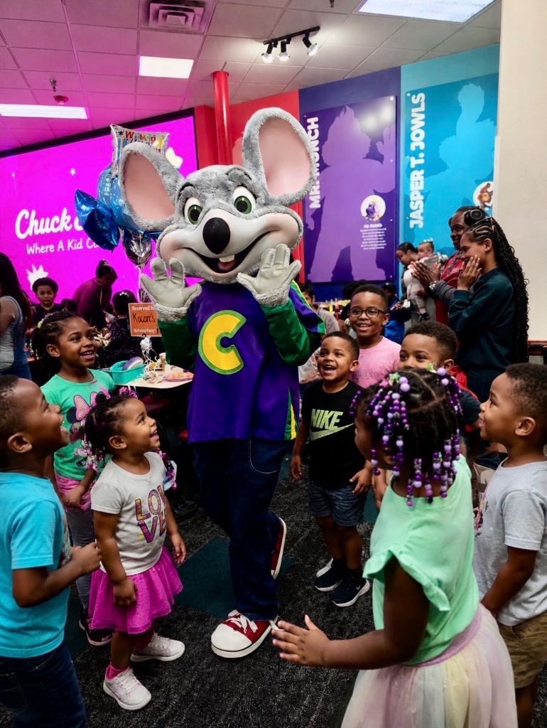 Chuck E. Cheese Birthday Party Children and staff celebrating at a Chuck E. Cheese birthday party outing with Insight Kidz Care Baltimore licensed family child care