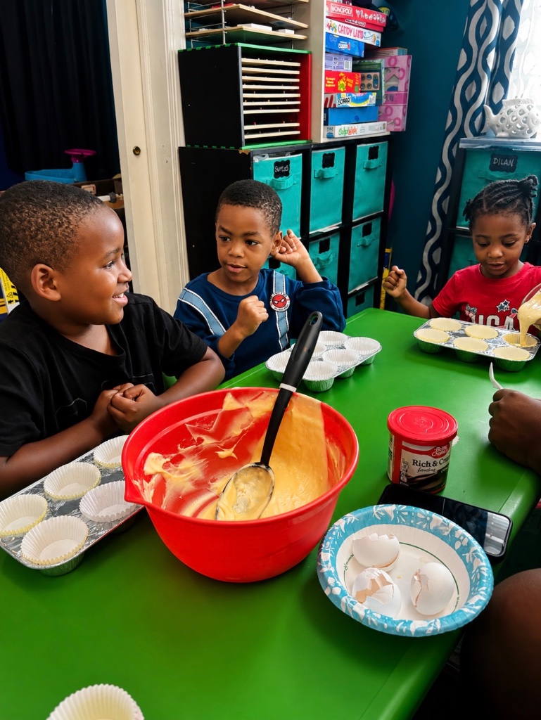 Mixing Cupcake Batter Children mixing cupcake batter and filling muffin tins during a hands-on cooking activity at Insight Kidz Care family child care in Baltimore