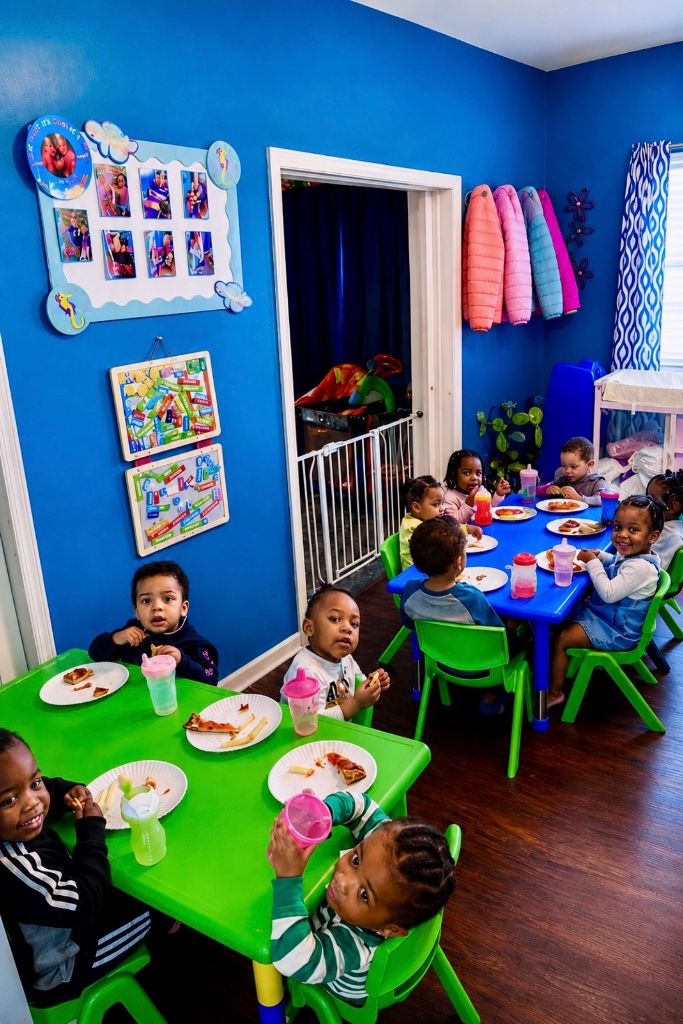 Family-Style Lunch Together Children eating a nutritious lunch together at tables at Insight Kidz Care licensed family child care in Baltimore Maryland