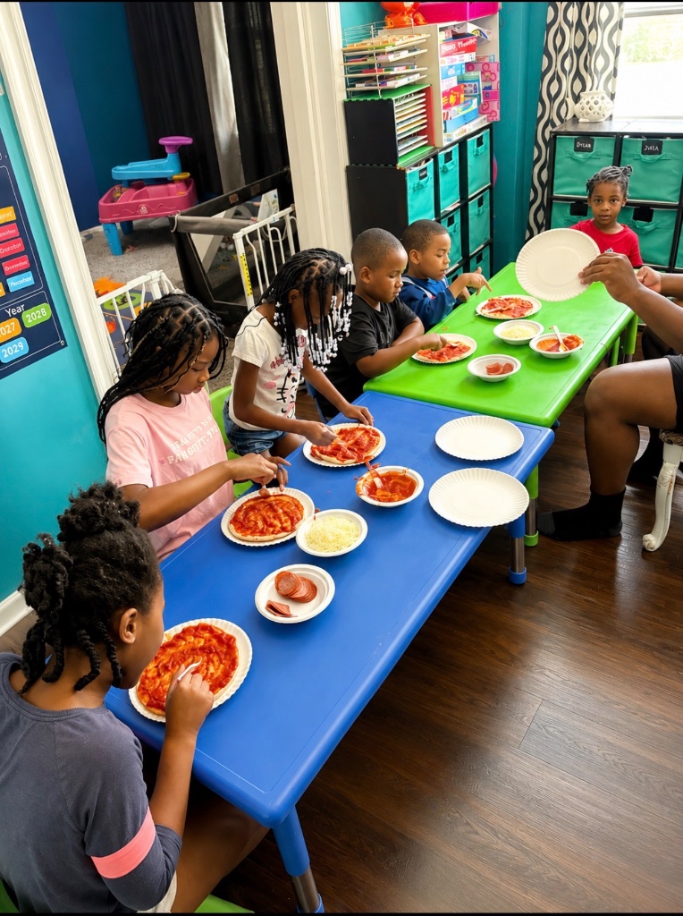 Personal Pizza Making Children assembling personal pizzas with sauce, cheese, and pepperoni during a cooking life skills activity at Insight Kidz Care