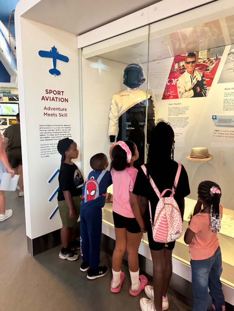 Sport Aviation Museum Exhibit Children exploring the Sport Aviation exhibit at a museum during a field trip with Insight Kidz Care licensed Baltimore child care