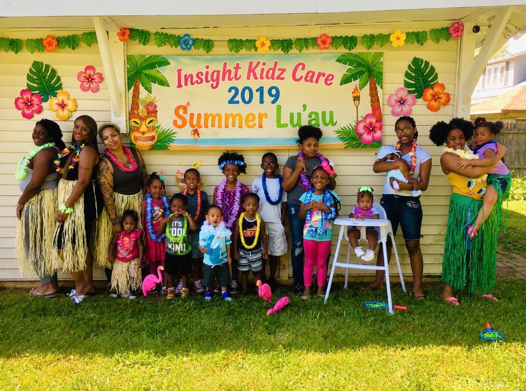 Summer Lu'au Party 2019 Children and caregivers celebrating the Insight Kidz Care 2019 Summer Lu'au party with leis and hula decorations in the backyard