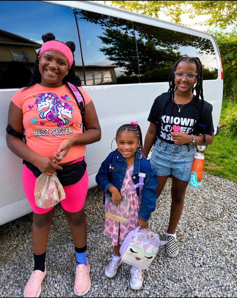 Happy School Arrival Children arriving safely beside an Insight Kidz Care transportation van in Baltimore.