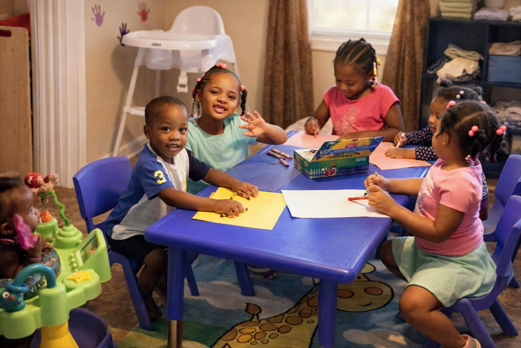 Children doing group art activities at Insight Kidz Care licensed child care in Baltimore MD 21206
