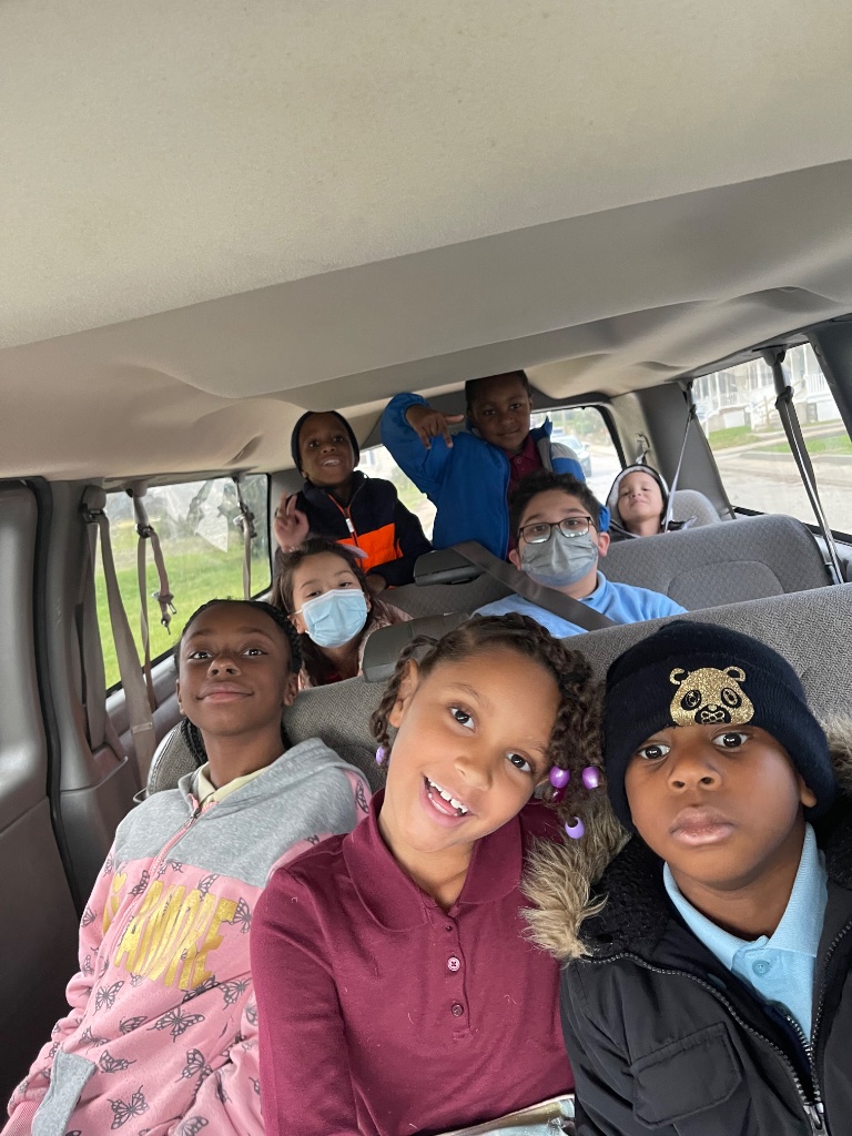 Safe Transportation in Action Children safely seated inside an Insight Kidz Care transportation van during school transportation in Baltimore.