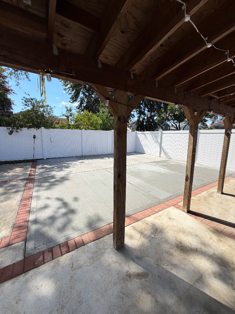 Concrete Patio with Brick Paver Border - Valley Stream, New York - TrueCraft Construction