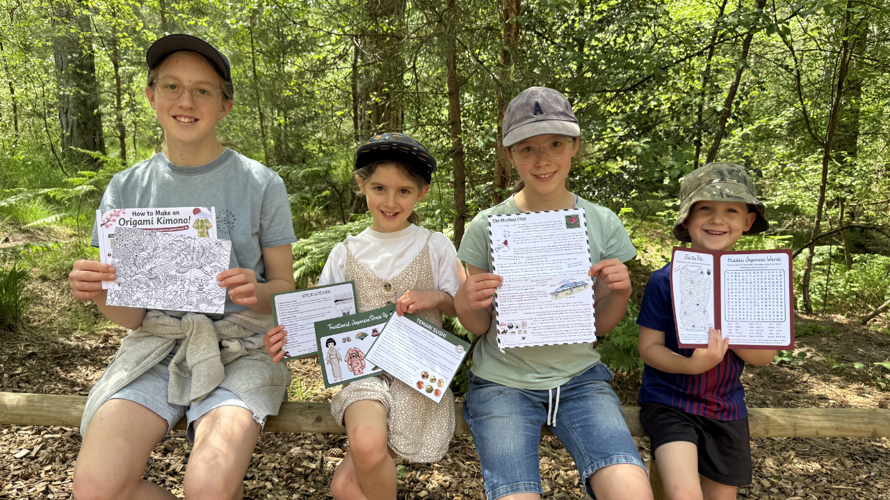 A child reading their Mailbox Club adventure letter