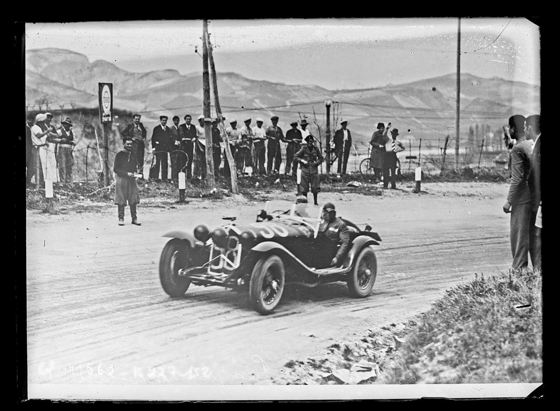 Tazio Nuvolari in a Scuderia Ferrari Alfa Romeo during the 1933 Mille Miglia.