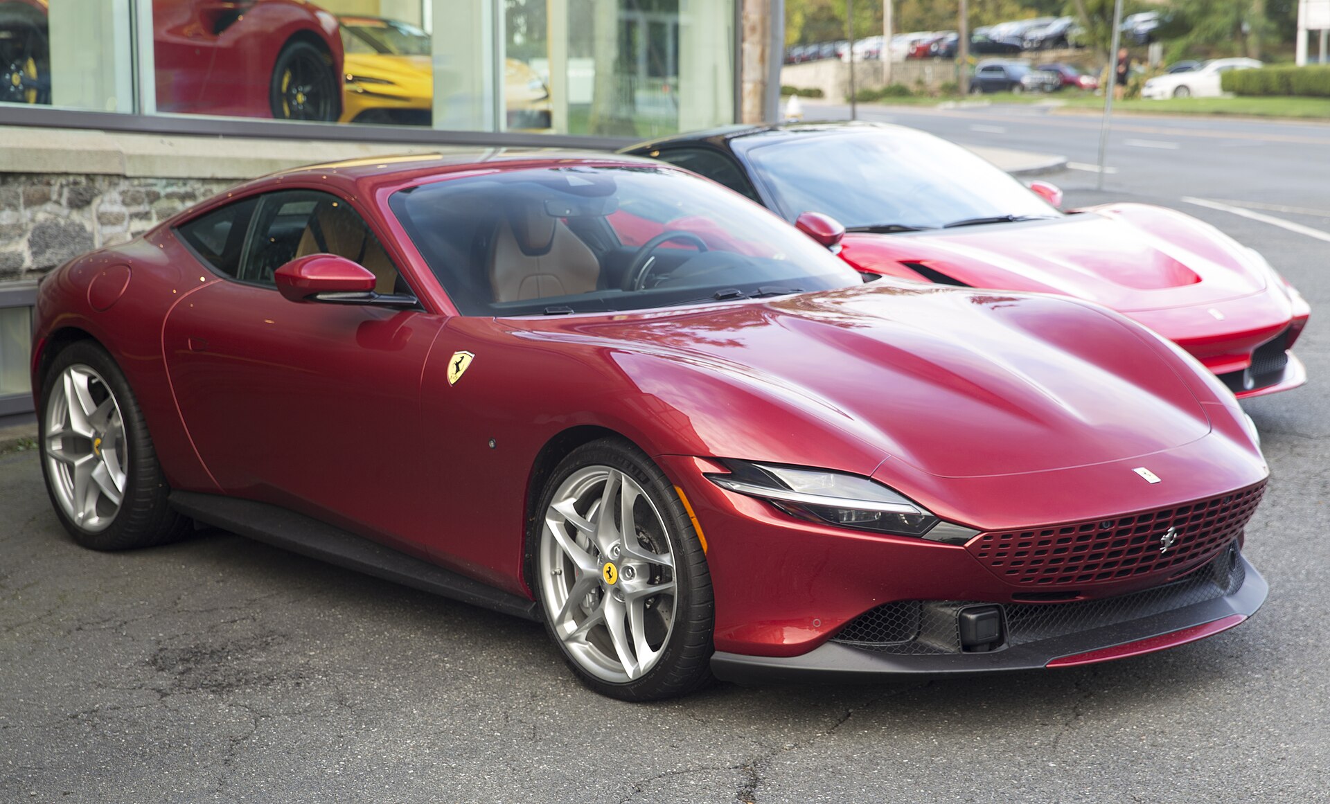 2021 Ferrari Roma, looks to be painted Rosso Fiorano (too many similar shades available for me to say with any certainty). Not a bad shape.