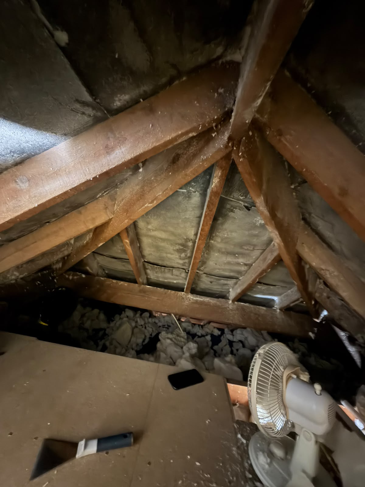 After — open-cell foam fully stripped from the rafters and felt