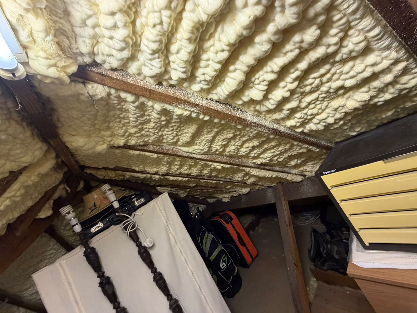 Before — open-cell spray foam applied between the rafters