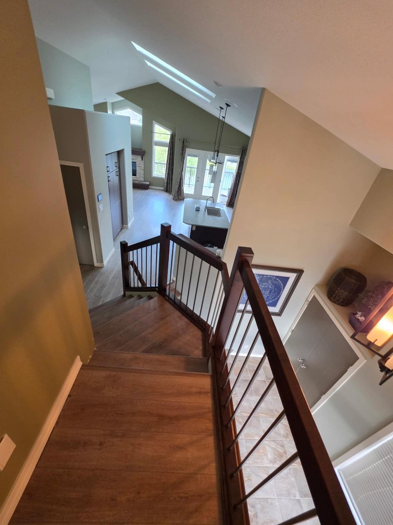 Clean staircase overlooking open living area after professional cleaning Lethbridge AB