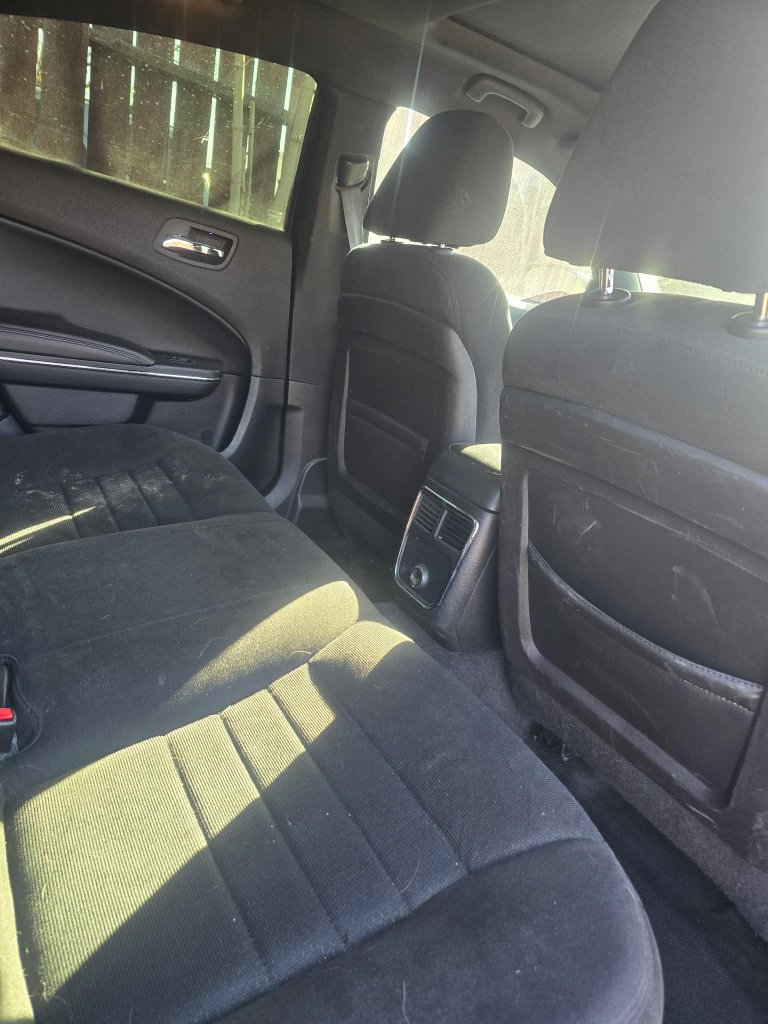 Dirty car back seat before professional interior detailing Lethbridge AB