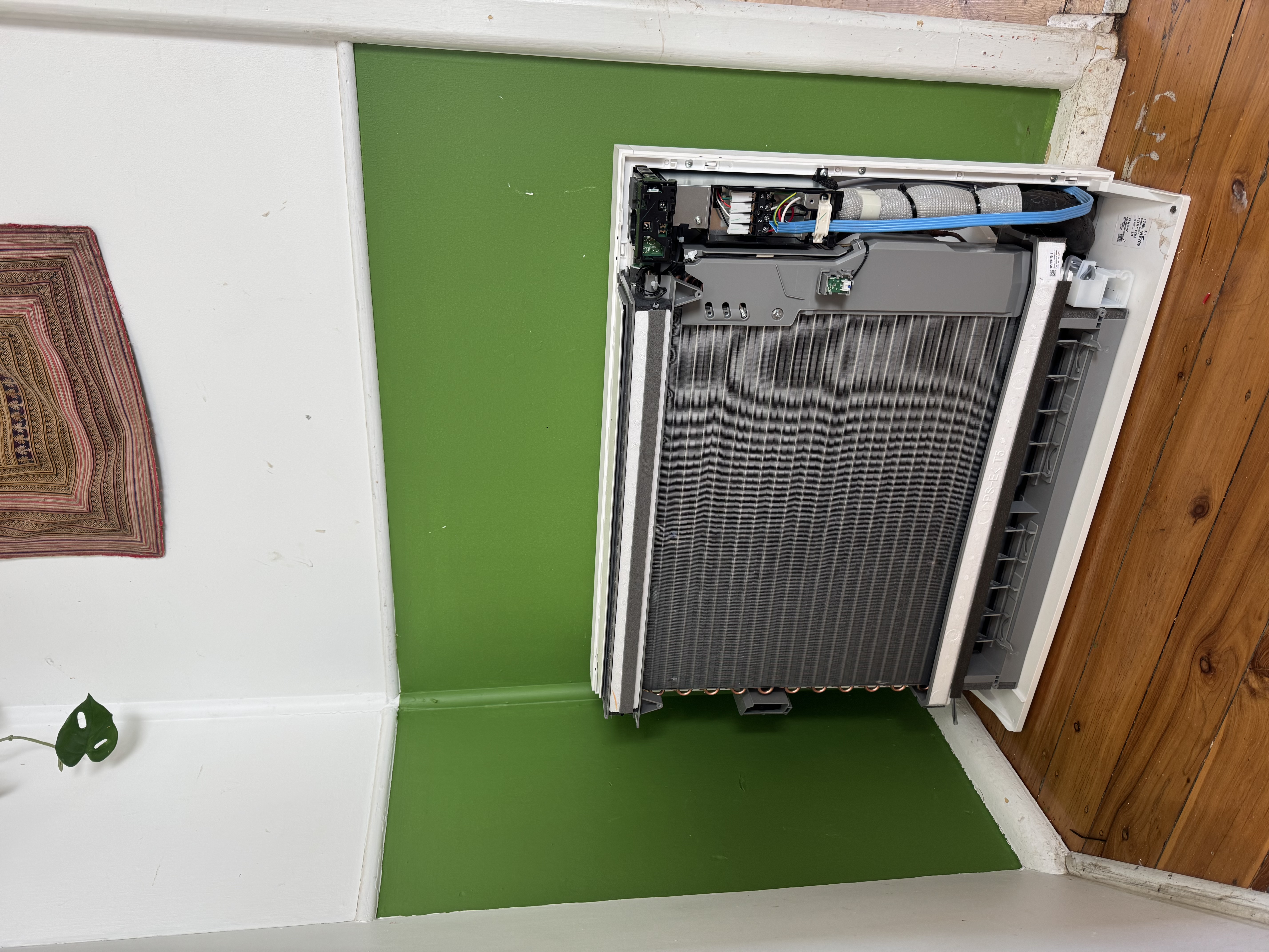 Floor-console air conditioner with its front cover removed at a Katoomba property