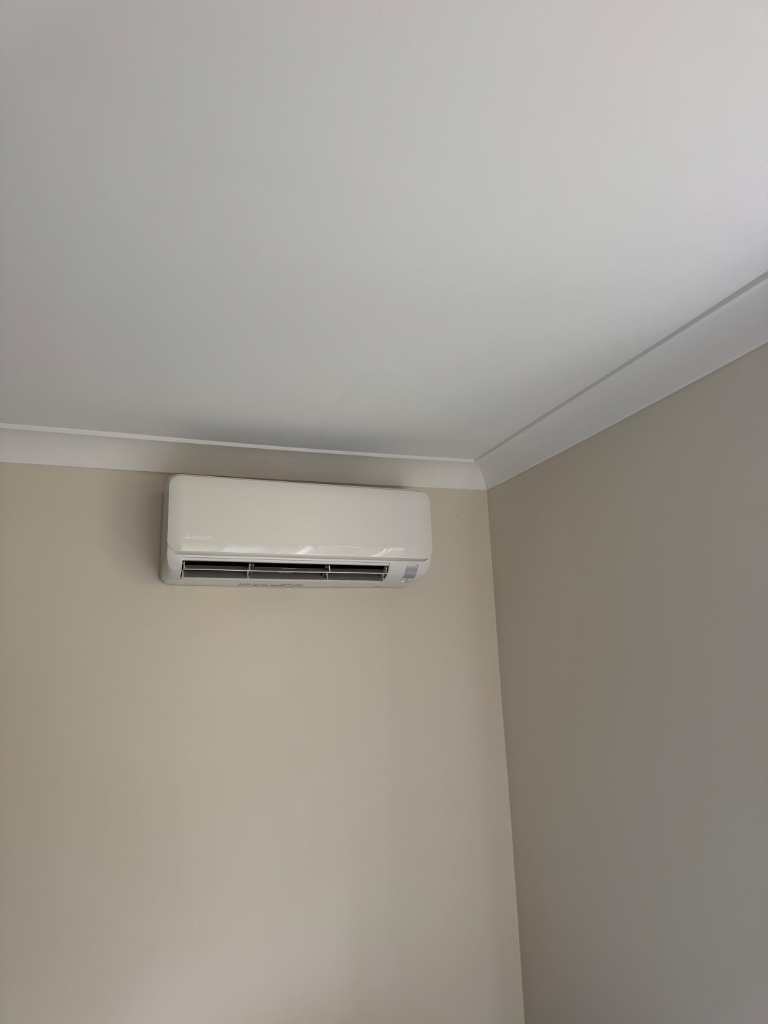 Mitsubishi Heavy Industries Ciara split system indoor unit installed in a corner below crown molding in Leura