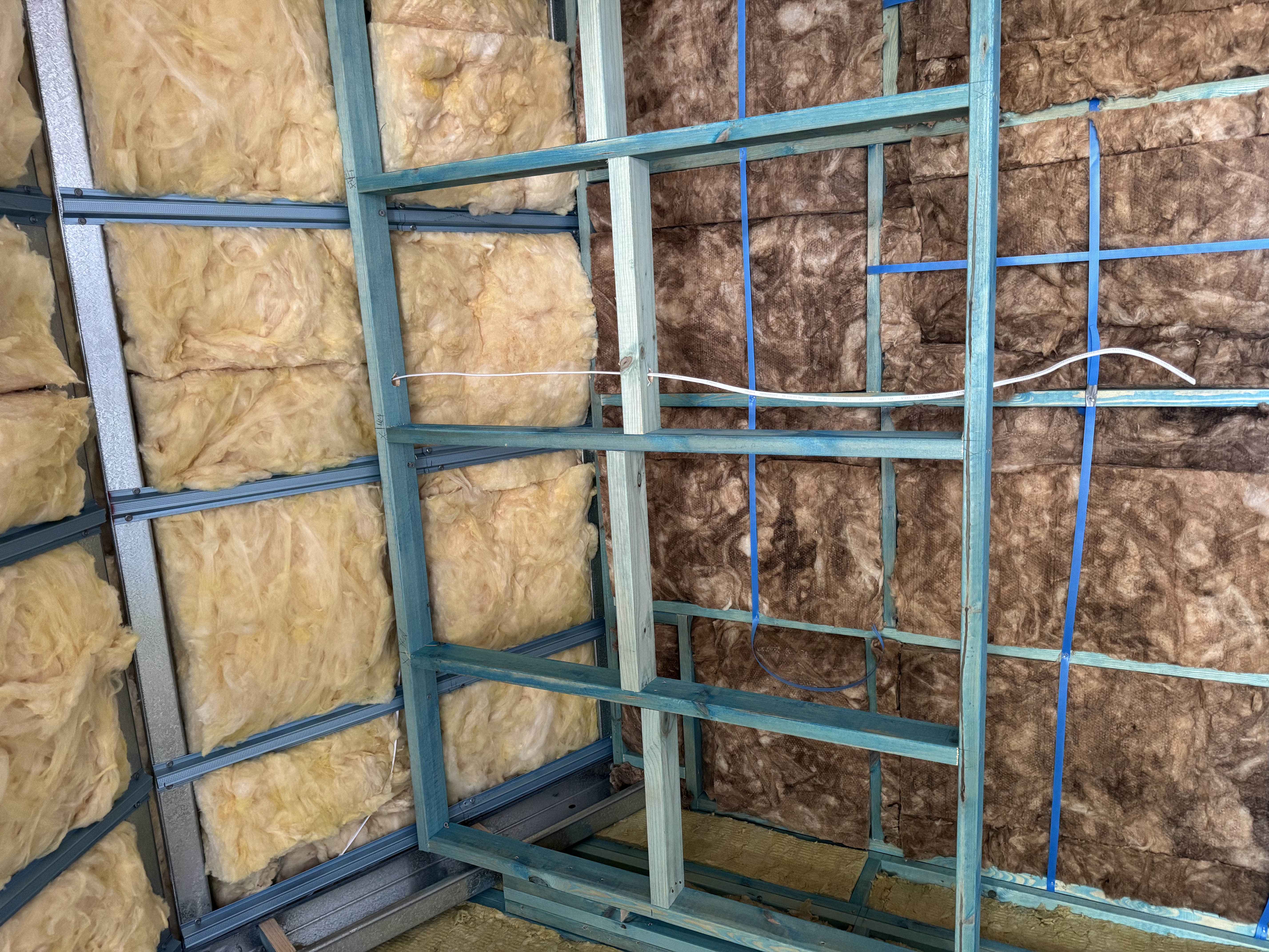 Rough-in wiring and exposed timber framing before wall lining at Mt Victoria