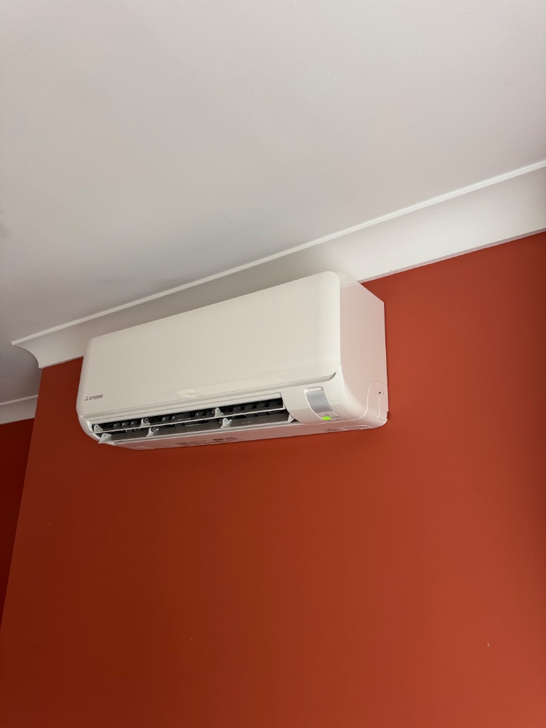 Mitsubishi Heavy Industries Ciara split system indoor unit on a terracotta red wall in Leura