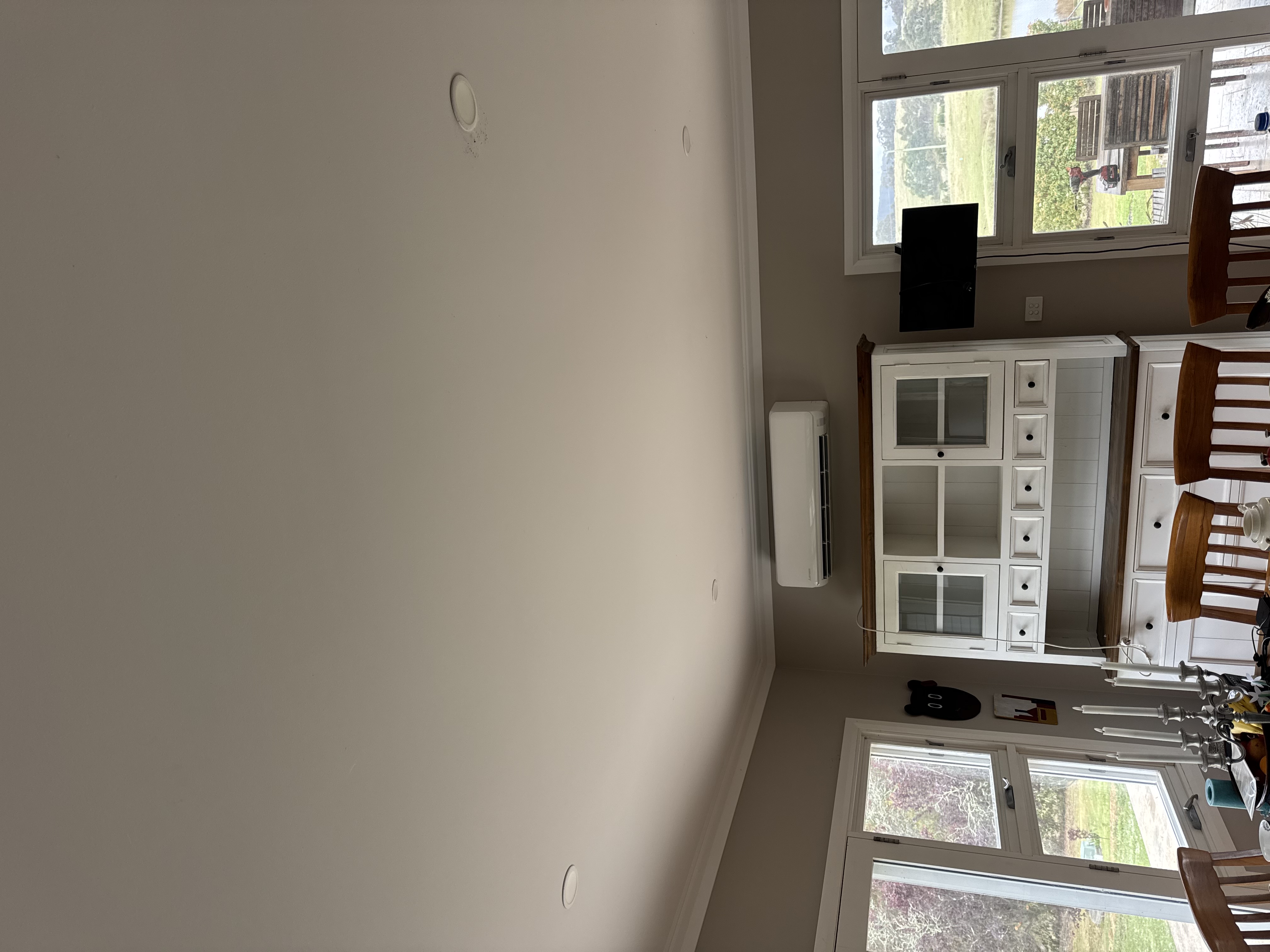 Wall-mounted split system above a dining room cabinet at a Hartley / Little Hartley property