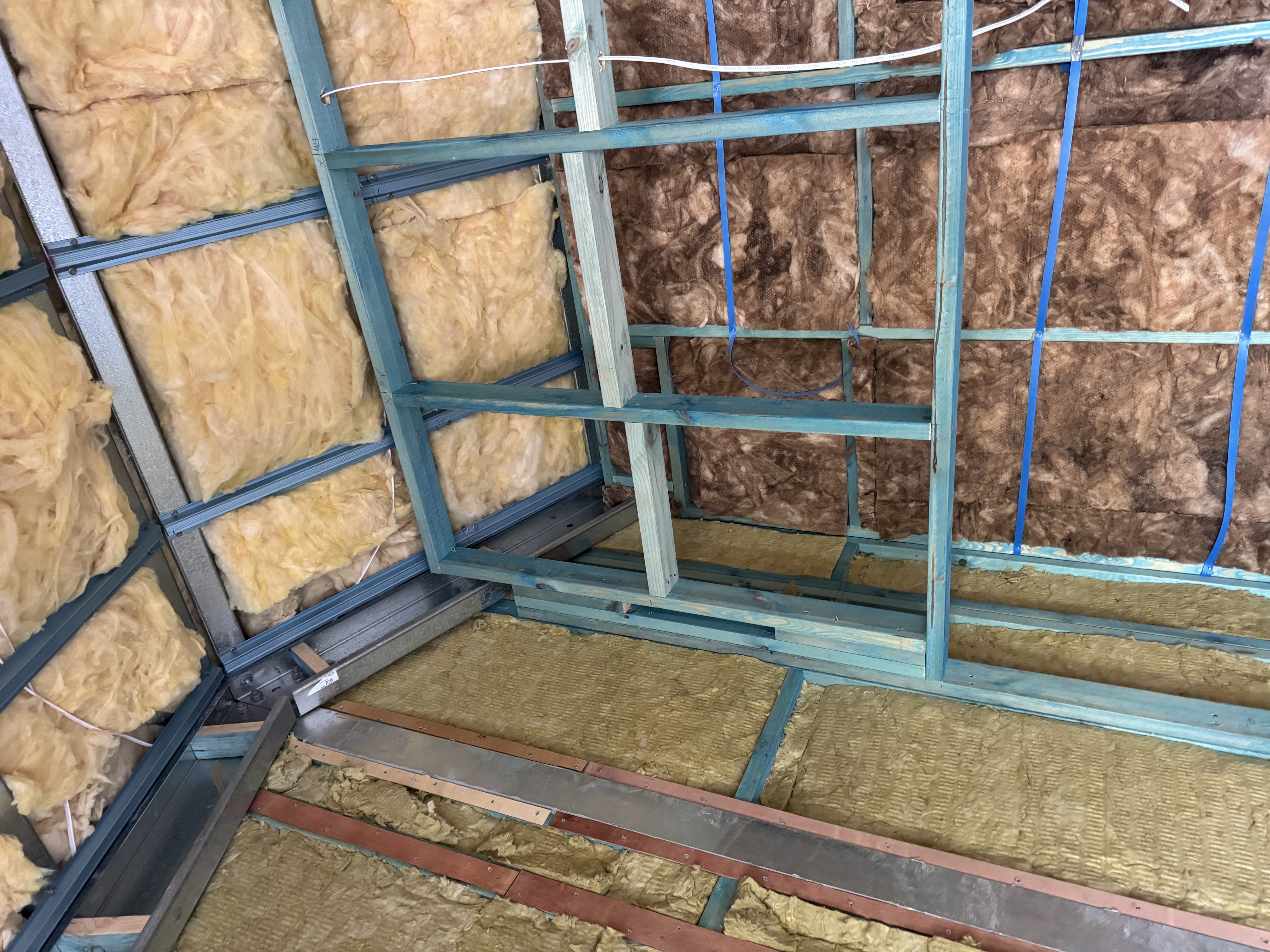 Corner of the insulated room showing exposed framing during the Mt Victoria rough-in stage