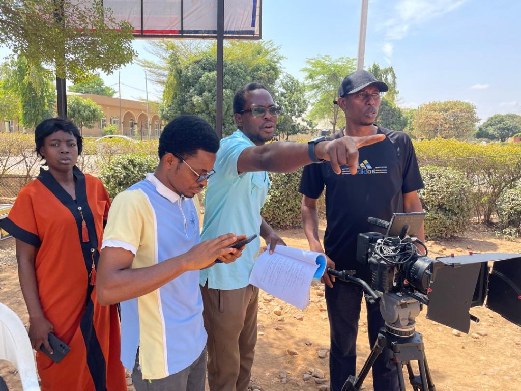 On set — director guiding the cast