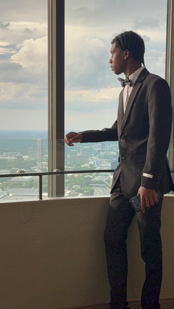 Student gazing over Atlanta skyline