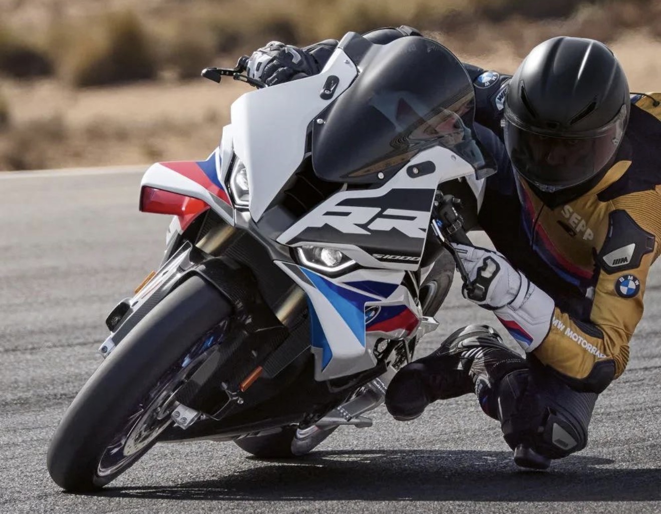 BMW S1000RR leaning into a track corner