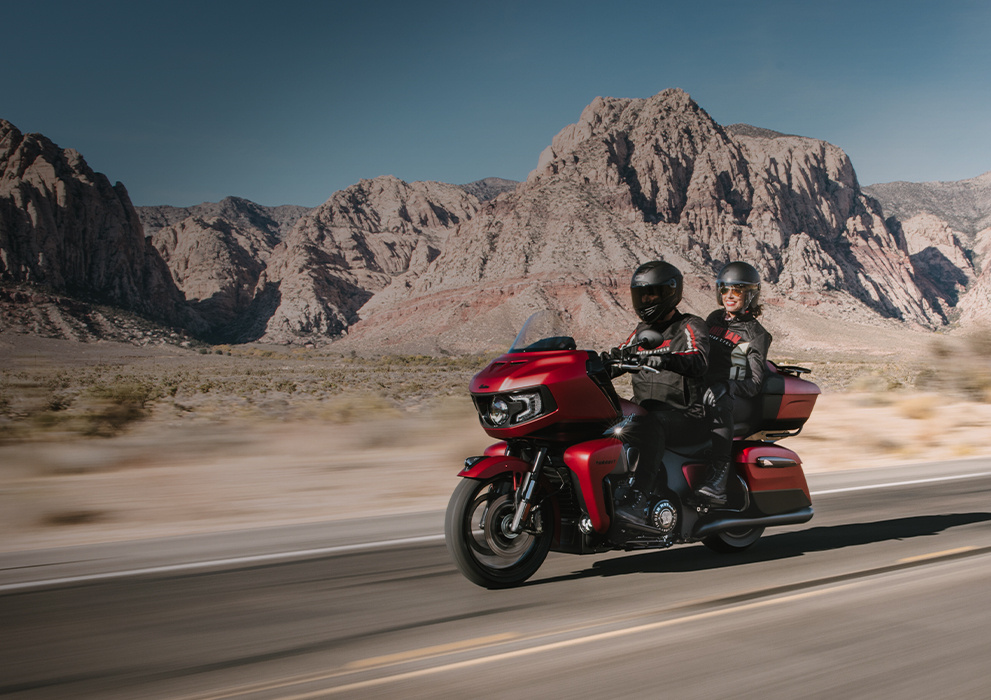 Red Indian Pursuit motorcycle being ridden on a desert road