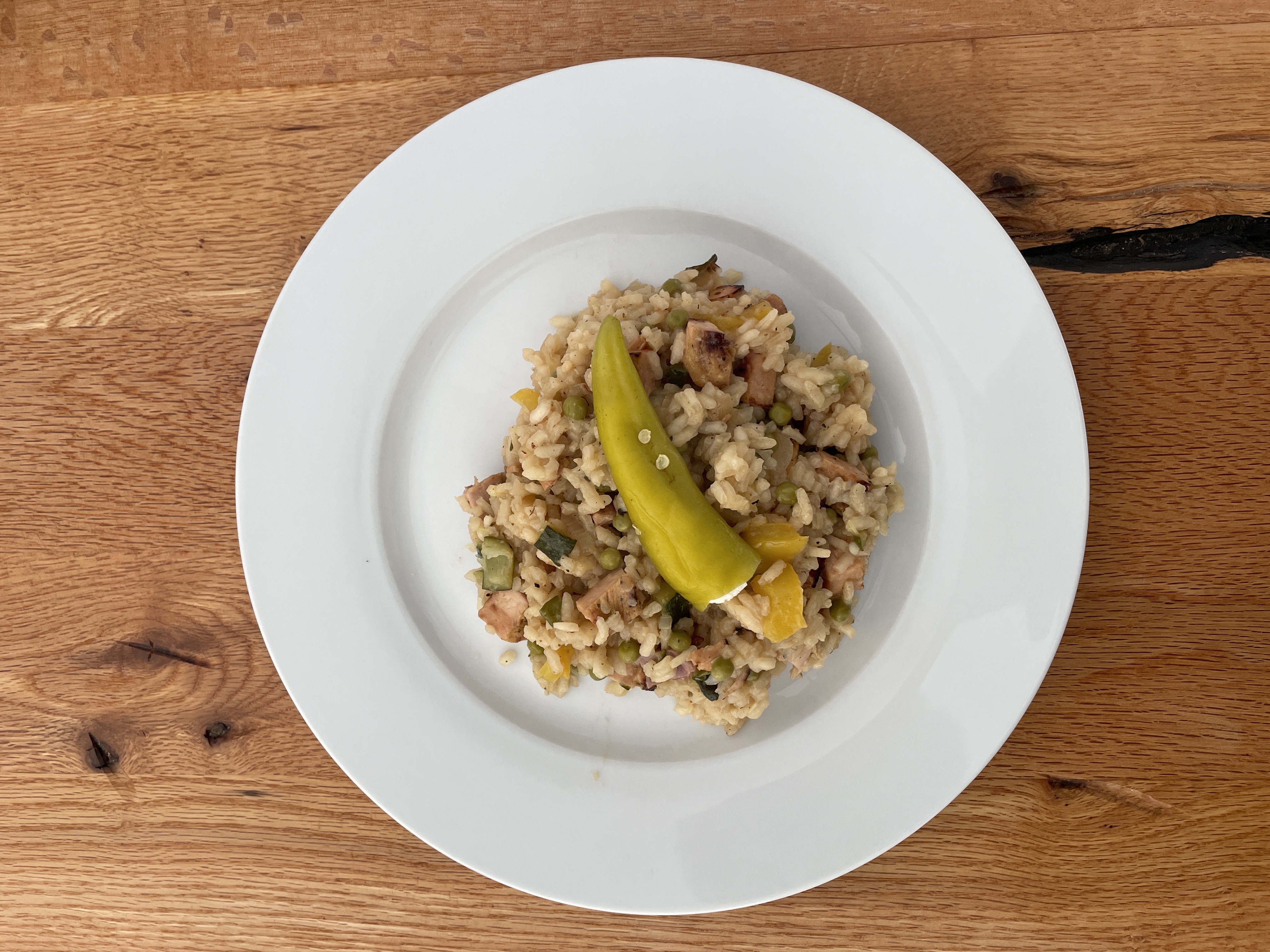 Hausgemachter Hähnchen-Paprika-Risotto von einem ResteChef-Nutzer, appetitlich auf einem Teller angerichtet.
