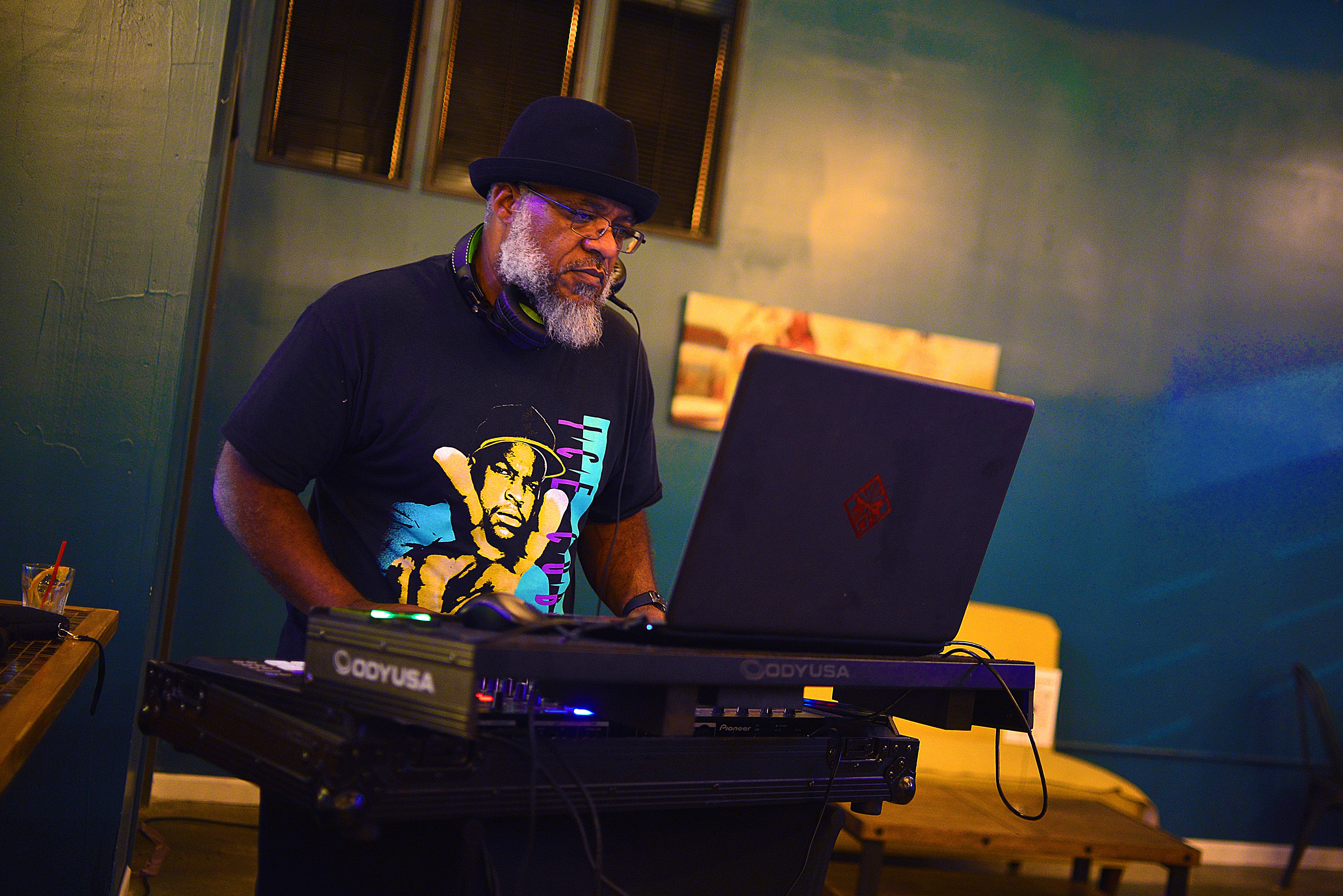 DJ Eddietunez at the console, focused on the mix