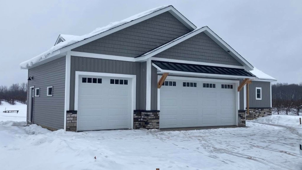 Completed new siding on the garage of a residential home