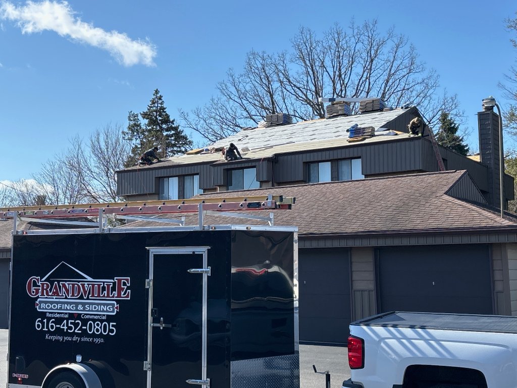 Completed roof replacement across apartment buildings in Wyoming, MI by Grandville Roofing & Exteriors