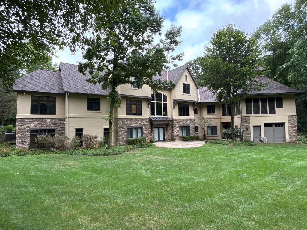 Completed shingle roof replacement viewed from the rear in Ada, MI