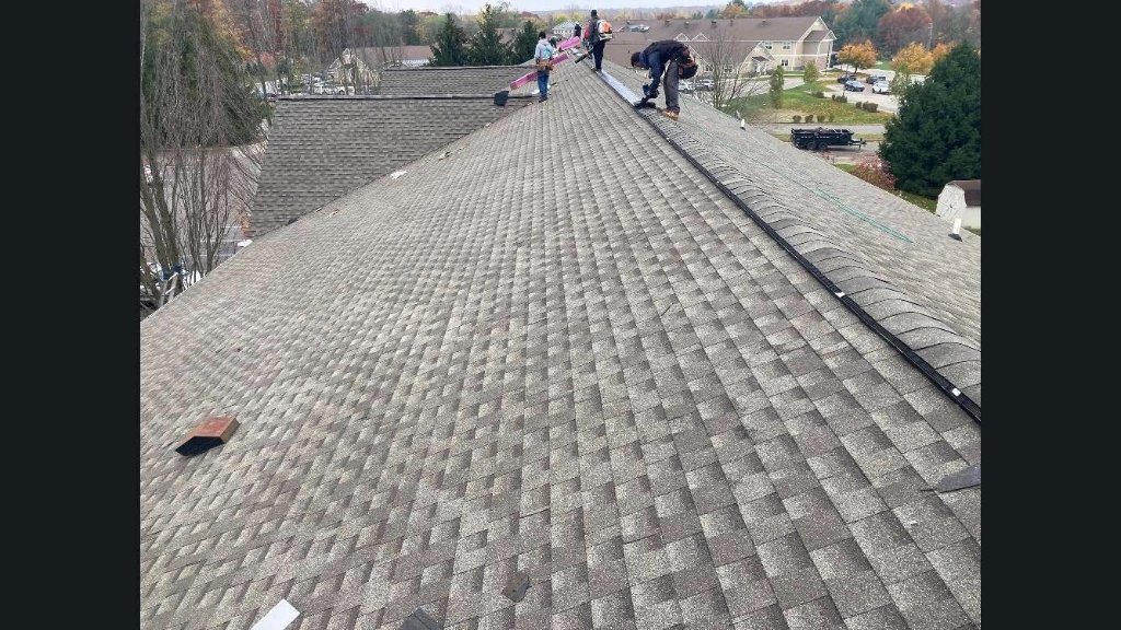Completed shingle installation on an apartment complex roof