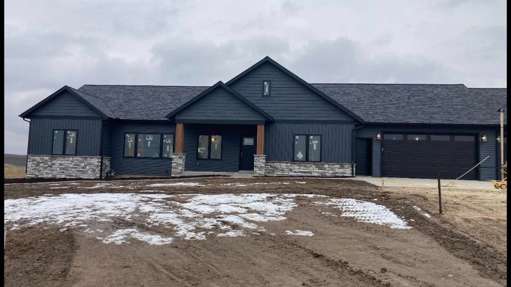 Completed exterior siding, front elevation, on a home in Sparta, MI