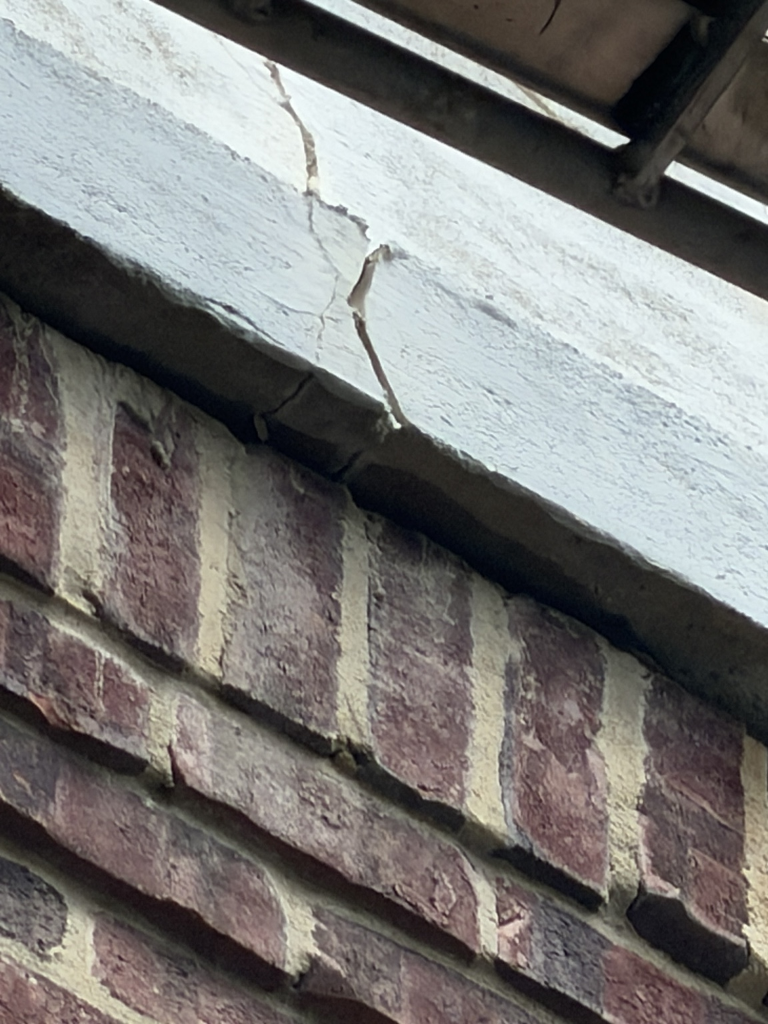 Damaged concrete before patching