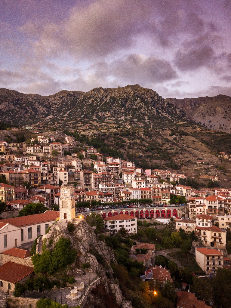 Arachova town with clock tower at dusk