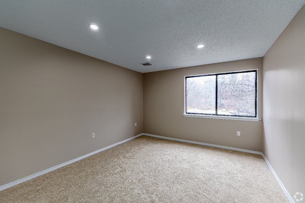 Room with sliding glass door and patio view