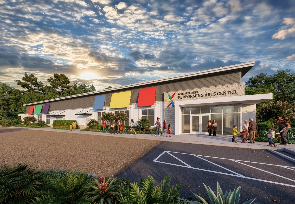 Architectural rendering of the Winter Springs Performing Arts Center in Winter Springs, FL — contemporary shed-roof civic building with colorful awnings, board-and-batten siding, stone entry, and landscaped arrival court at golden hour
